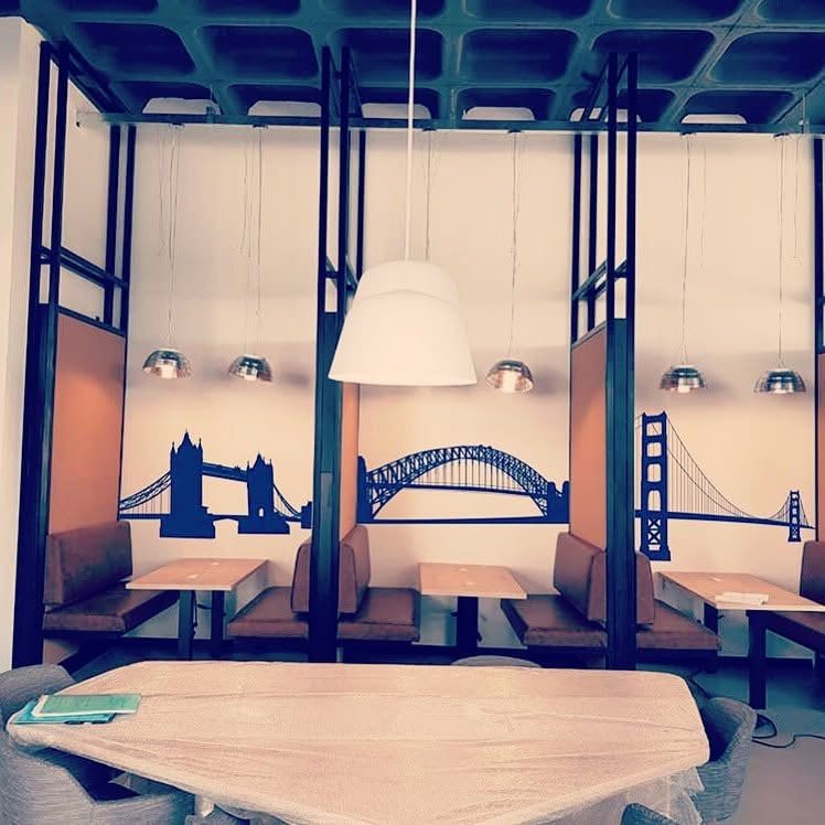 Bridge skyline silhouettes printed behind office booths