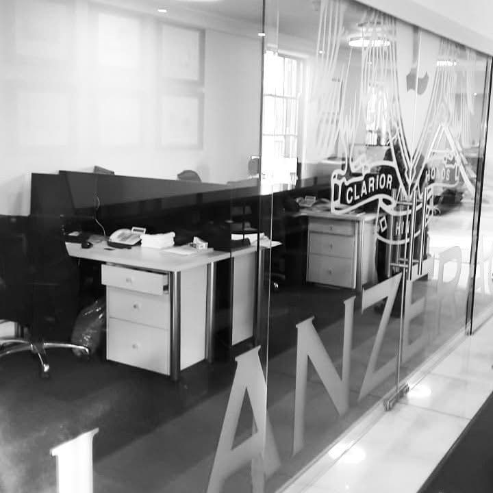 Frosted vinyl Lanzerac lettering on the glass of a reception office
