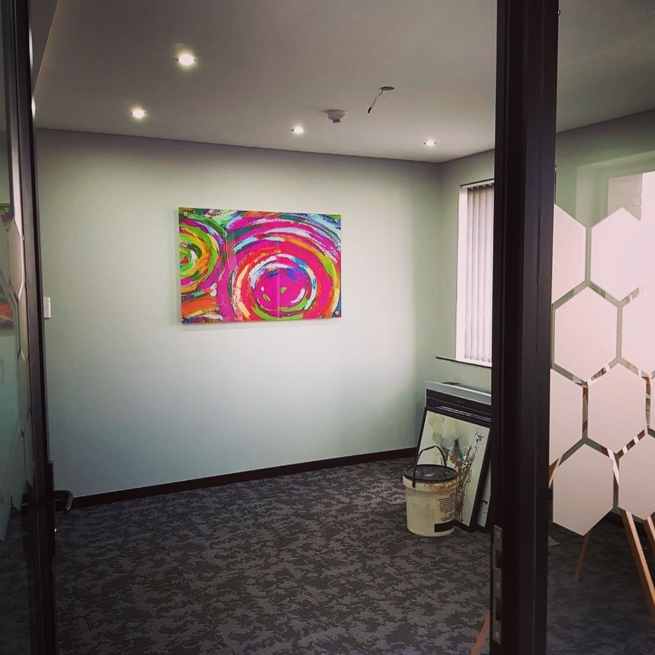 Bright abstract canvas print on an office wall