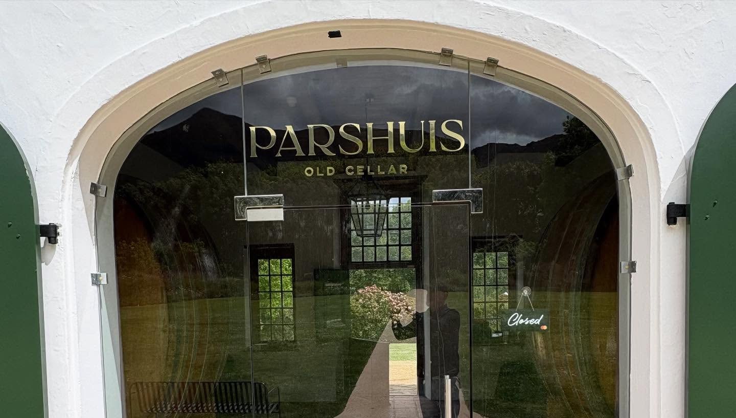 Parshuis Old Cellar lettering seen through the arched cellar entrance