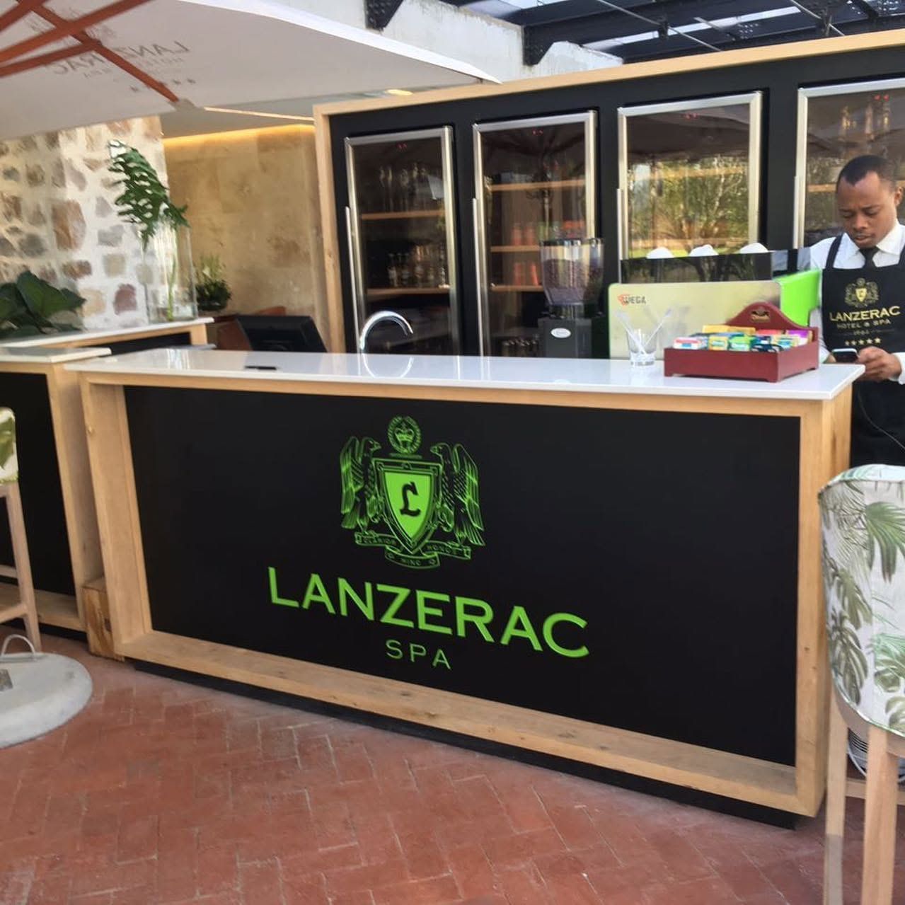 Lanzerac Spa bar front with green crest, seen from the side