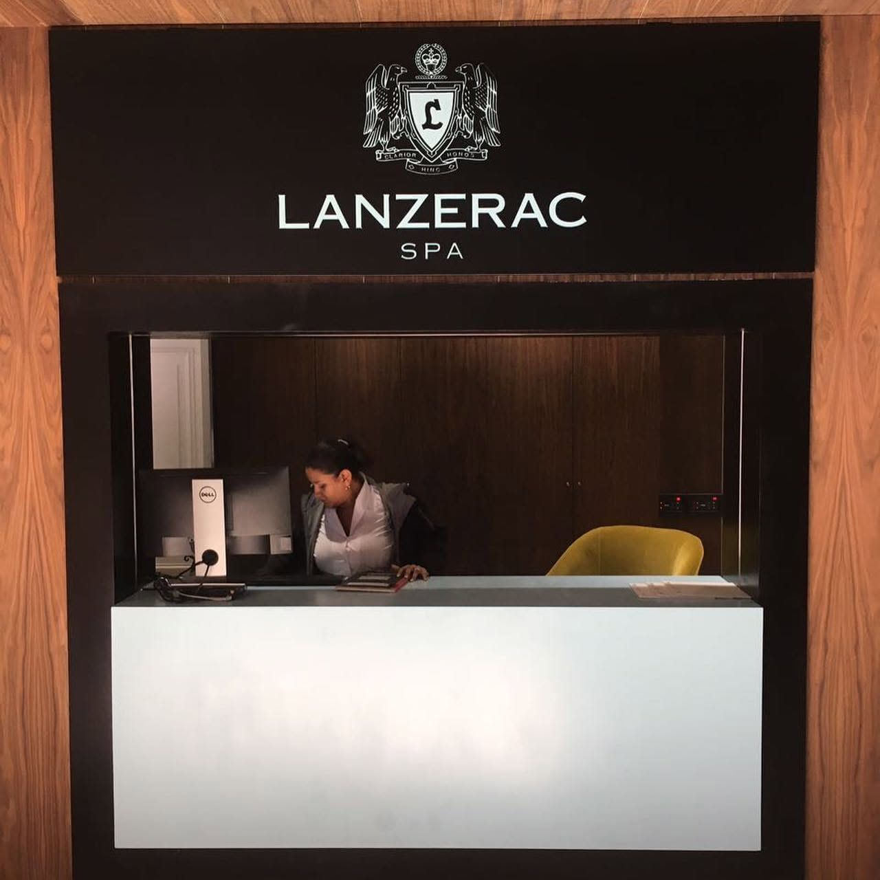Lanzerac Spa branding above a white reception desk