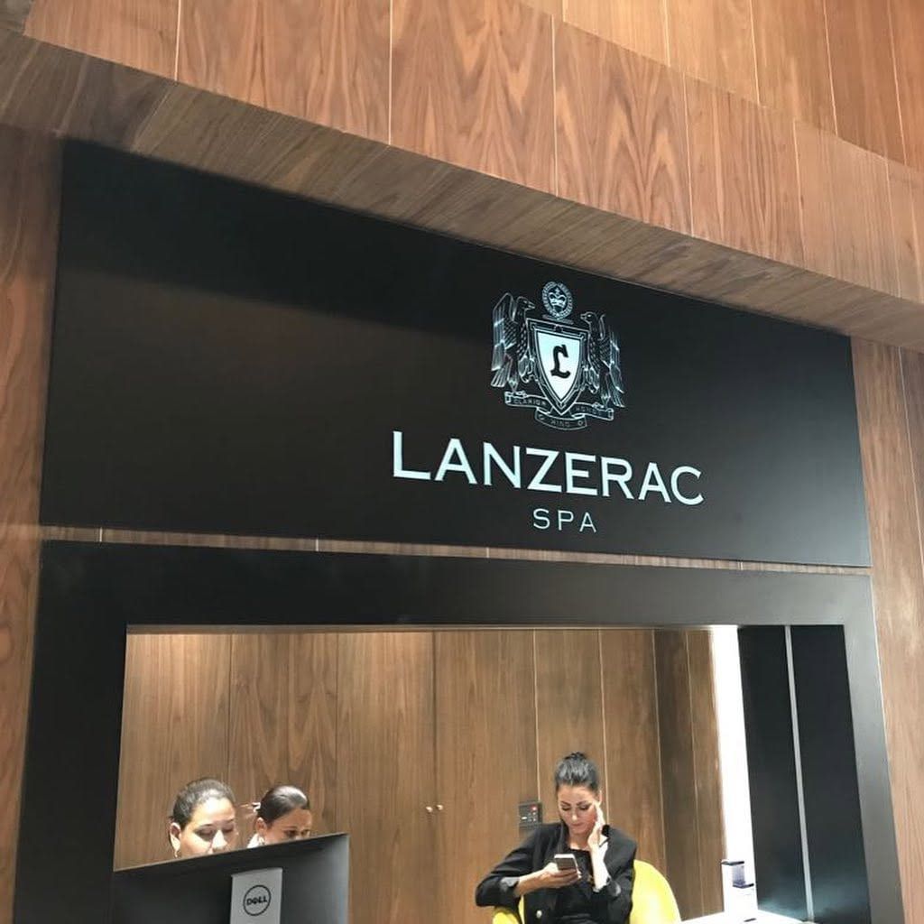 Lanzerac Spa reception with the crest and lettering on a black fascia