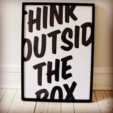 Framed typographic print reading Think outside the box