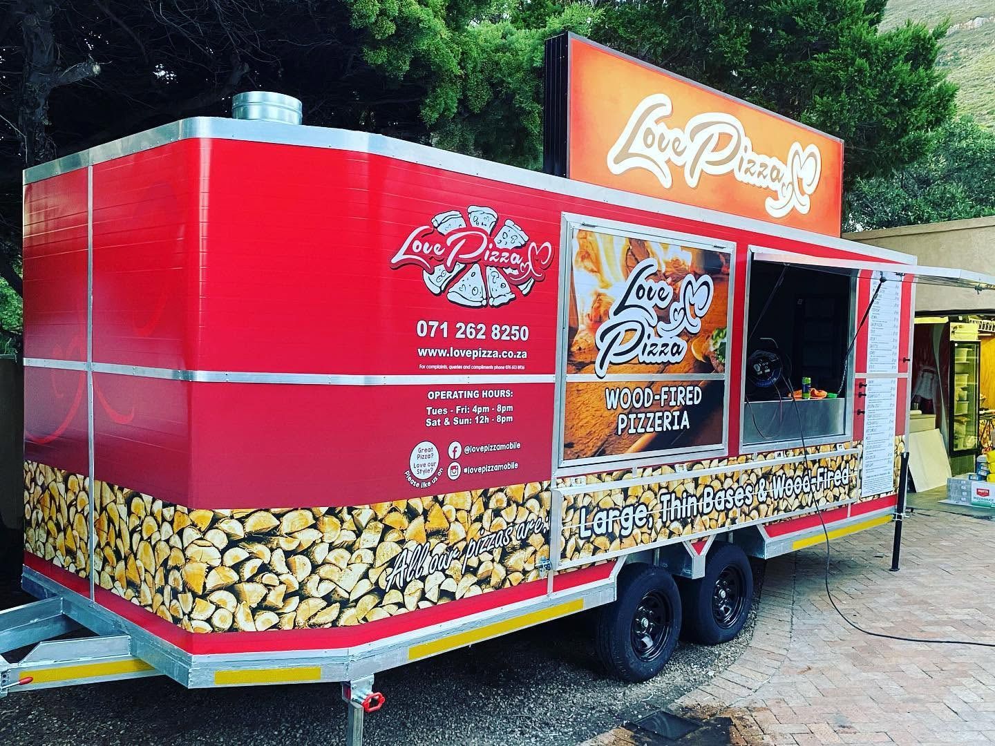 Love Pizza trailer wrap seen from the rear corner